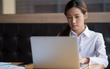 Person working on a laptop at a desk, representing online or on-demand learning.