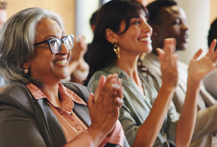 Business people, audience and applause with presentation, summit and seminar event. Workshop, achievement and success announcement with growth, sales proposal and crowd support for conference pitch