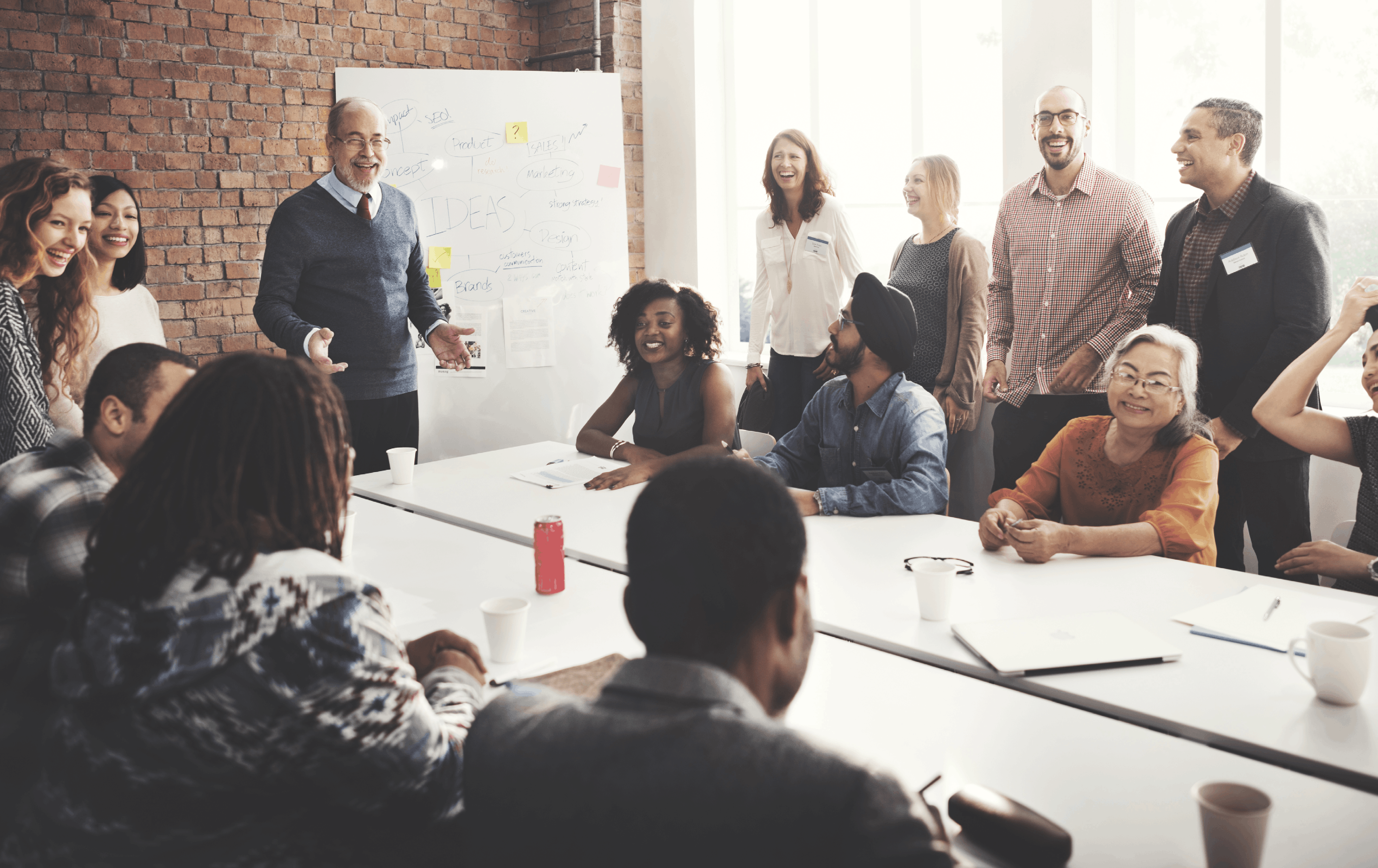 A team gathered in a meeting room and having a discussion.